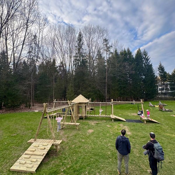 Running Rhino playground at Kavarna Lokus in Koseze, Ljubljana, featuring a central tower, balance obstacles, rope elements and natural robinia wood construction 